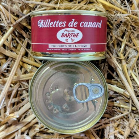Fétu de paille sur laquelle est posée une boite de rillette de canard